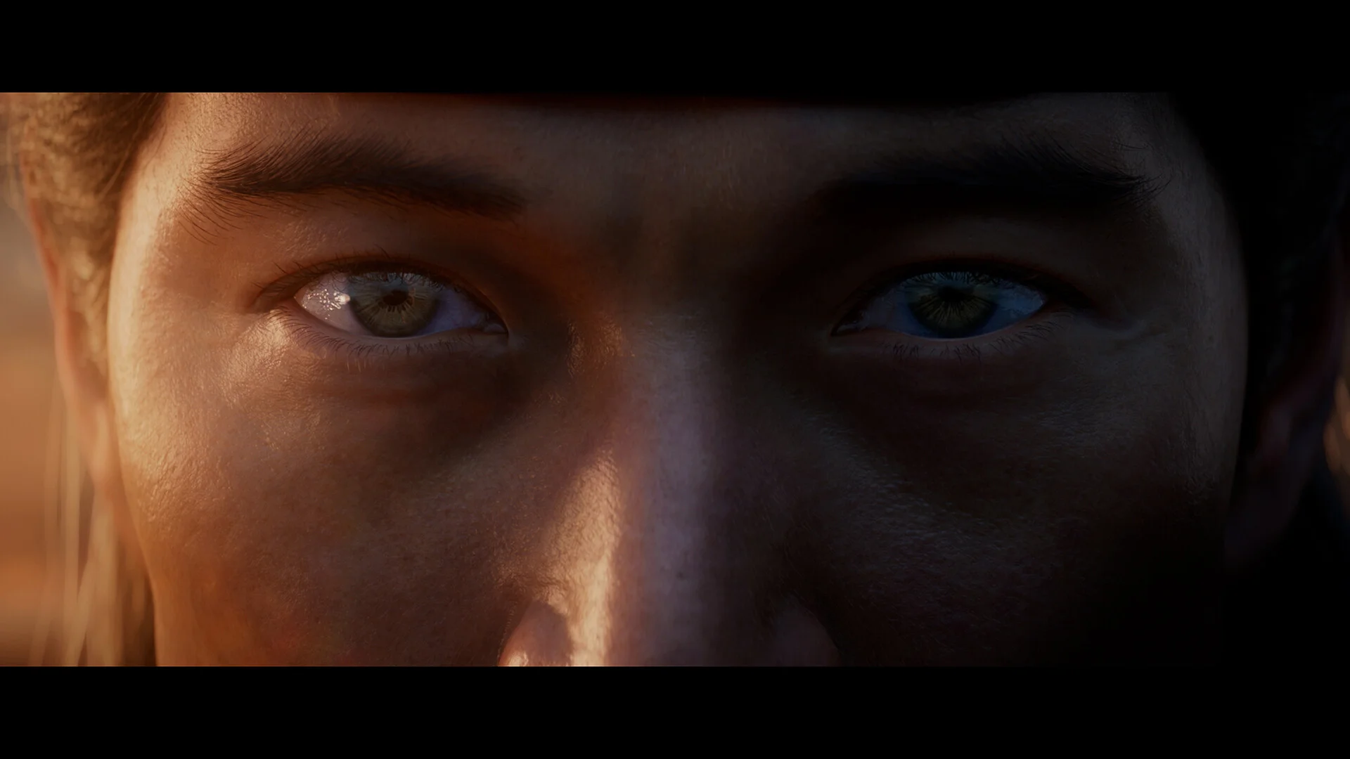 Extreme close-up of Liu Kang's eyes in warm outdoor light