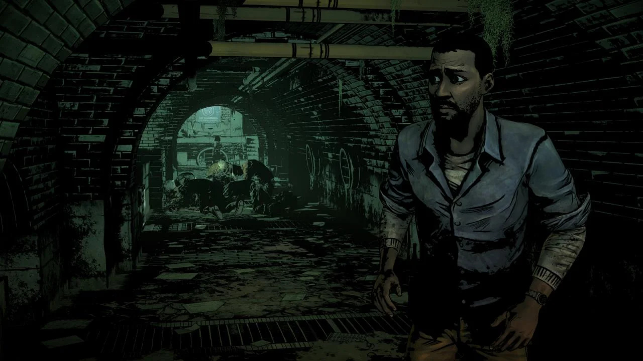 A bearded man in a brick sewer tunnel with bodies on the floor behind him