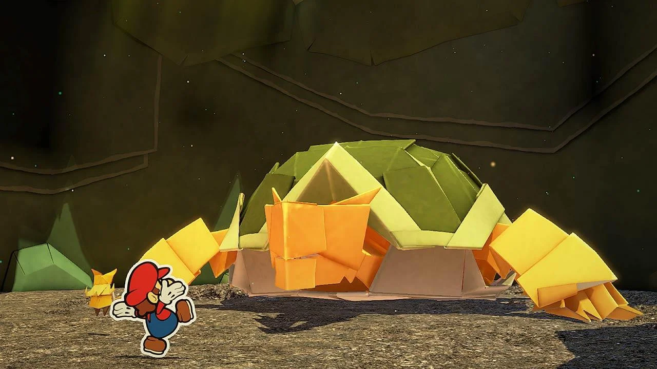Mario facing a tunnel of orange folded paper.