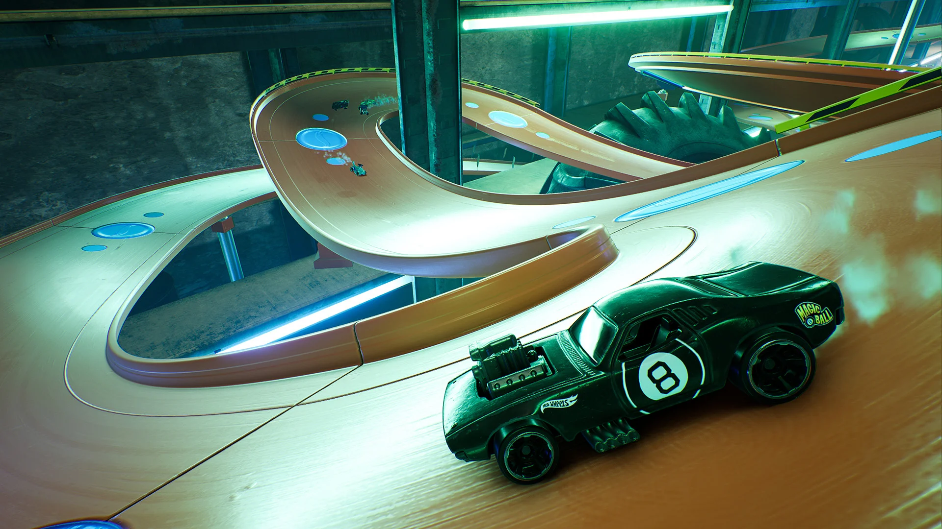 A black car with a green circular logo on a teal track.