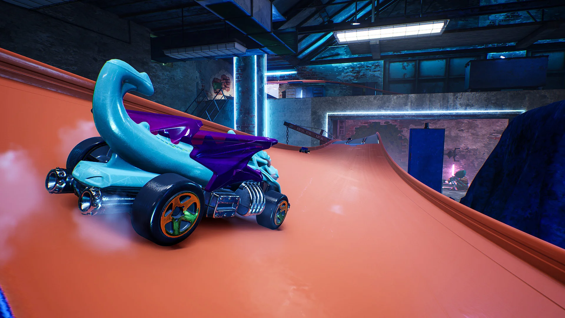 A blue and purple Hot Wheels car on an orange loop.