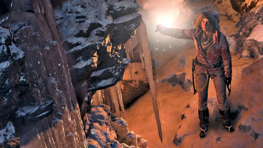 Lara Croft holding a flare beside ice in a cave