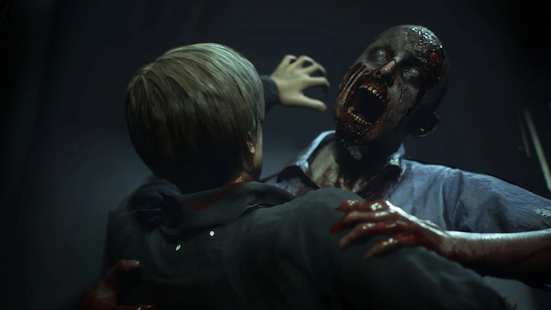 Short blond hair from behind as a screaming walker in a blue shirt grabs the shoulders