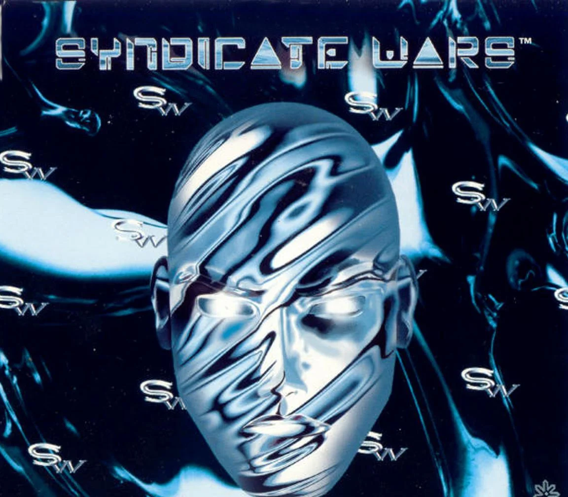 Syndicate Wars cover, a metallic face on a blue field with the title.