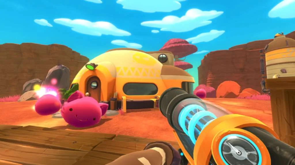 Yellow dome ranch house, two pink slimes with fruit, vacpack nozzle on wooden planks