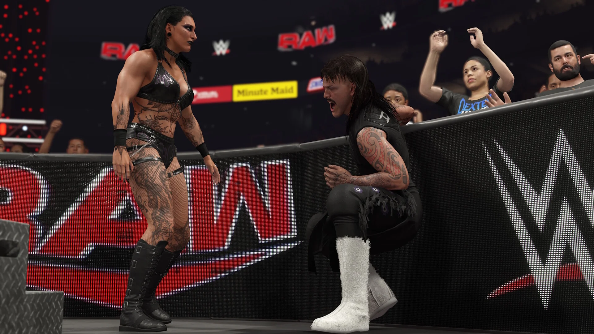 RAW ringside: tattooed Superstar in black leather, kneeling rival, white boot, LED apron