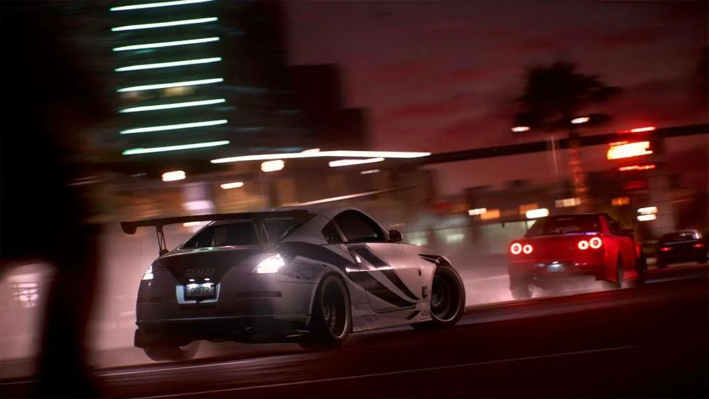 Night street race with a dark coupe and red taillights.