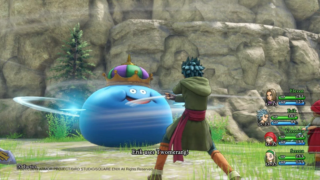 A turn-based battle against a large blue slime in a rocky pass.