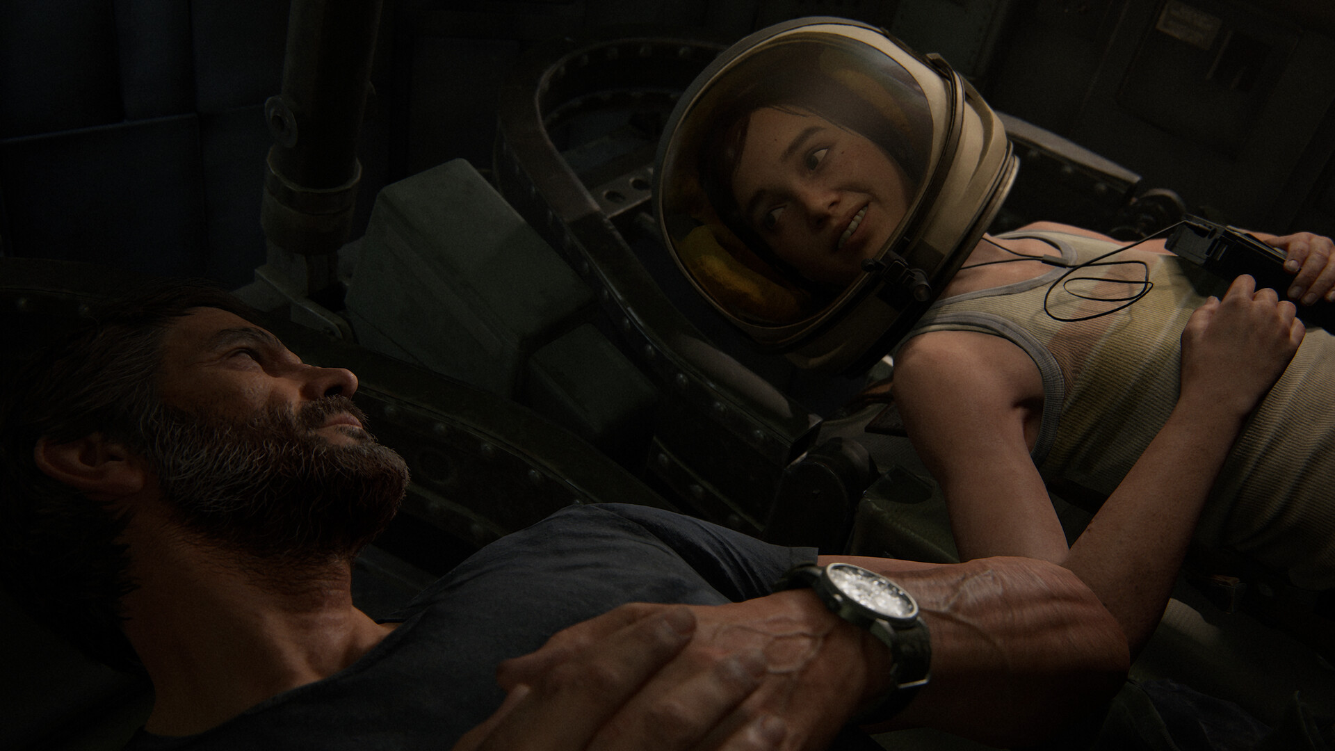 Ellie in a space helmet watches Joel sleep