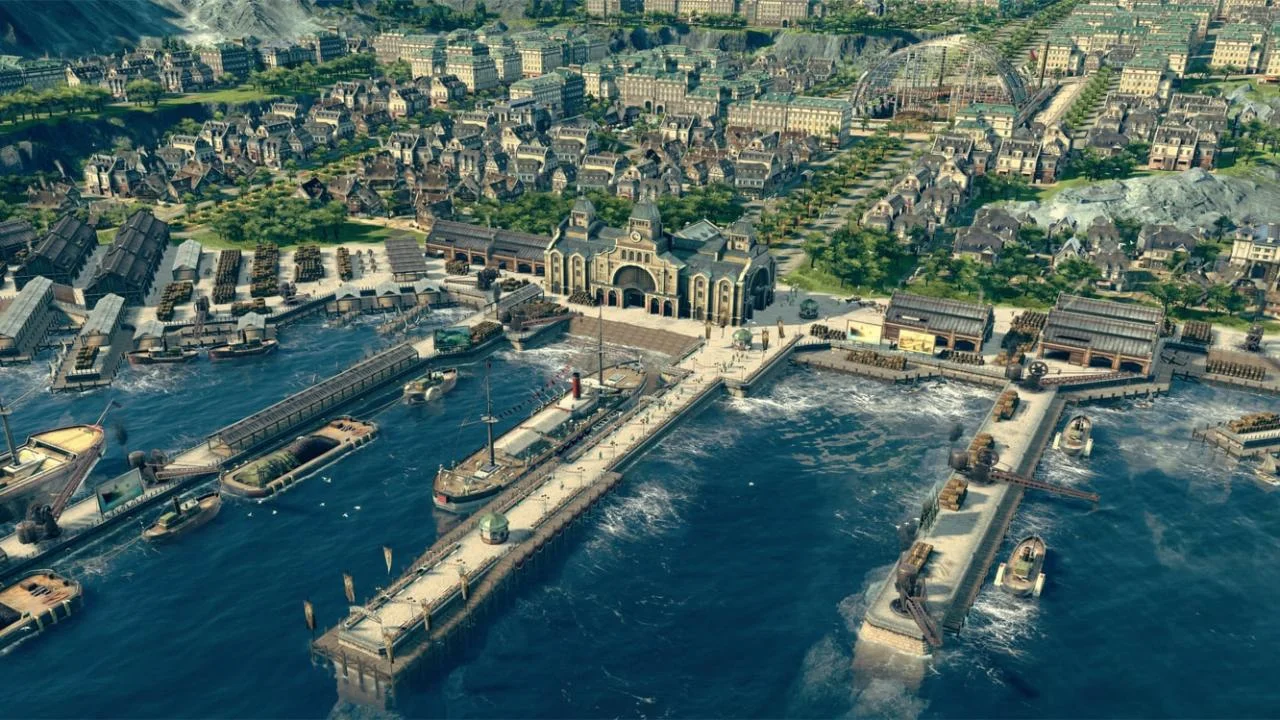 Aerial of a stone harbour station with long piers, warehouses, packed streets and a glass hall in the distance