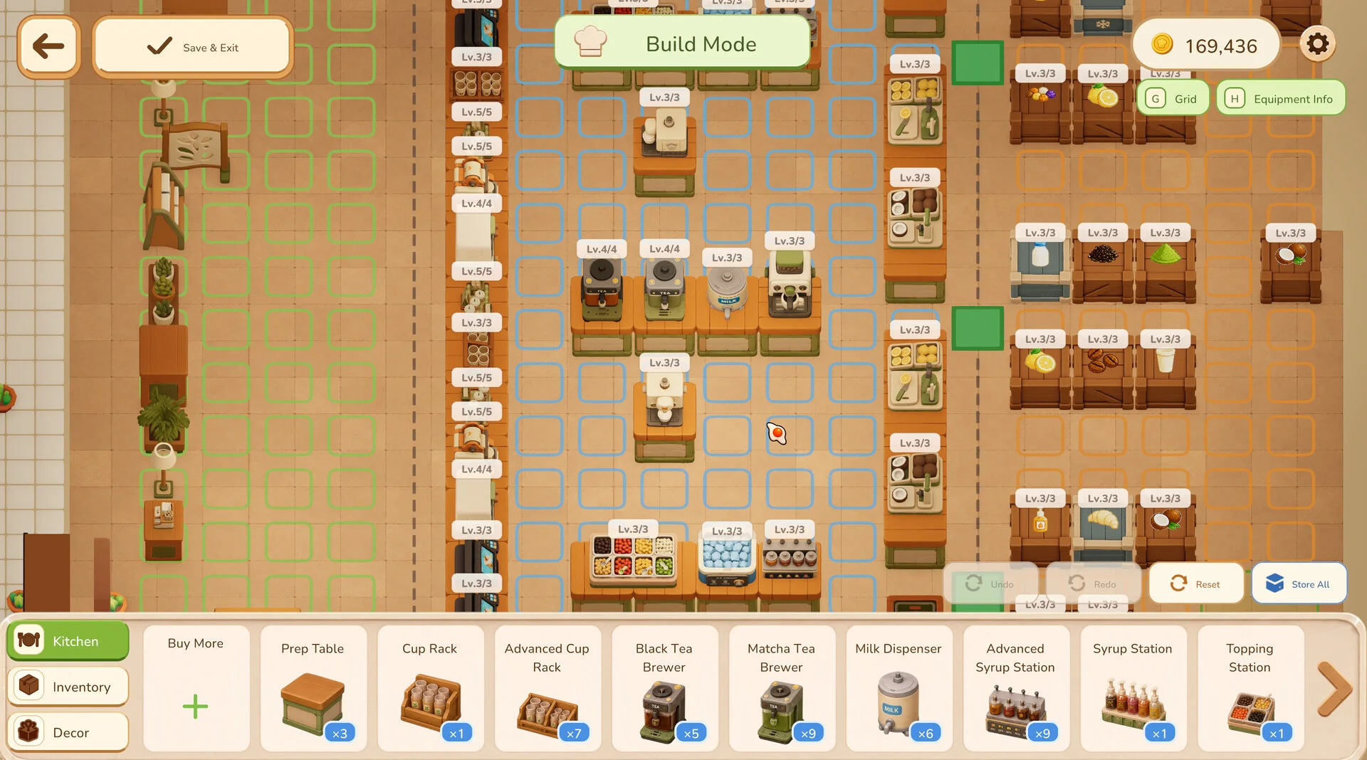 Grid-based build mode showing kitchen zones, equipment levels and inventory