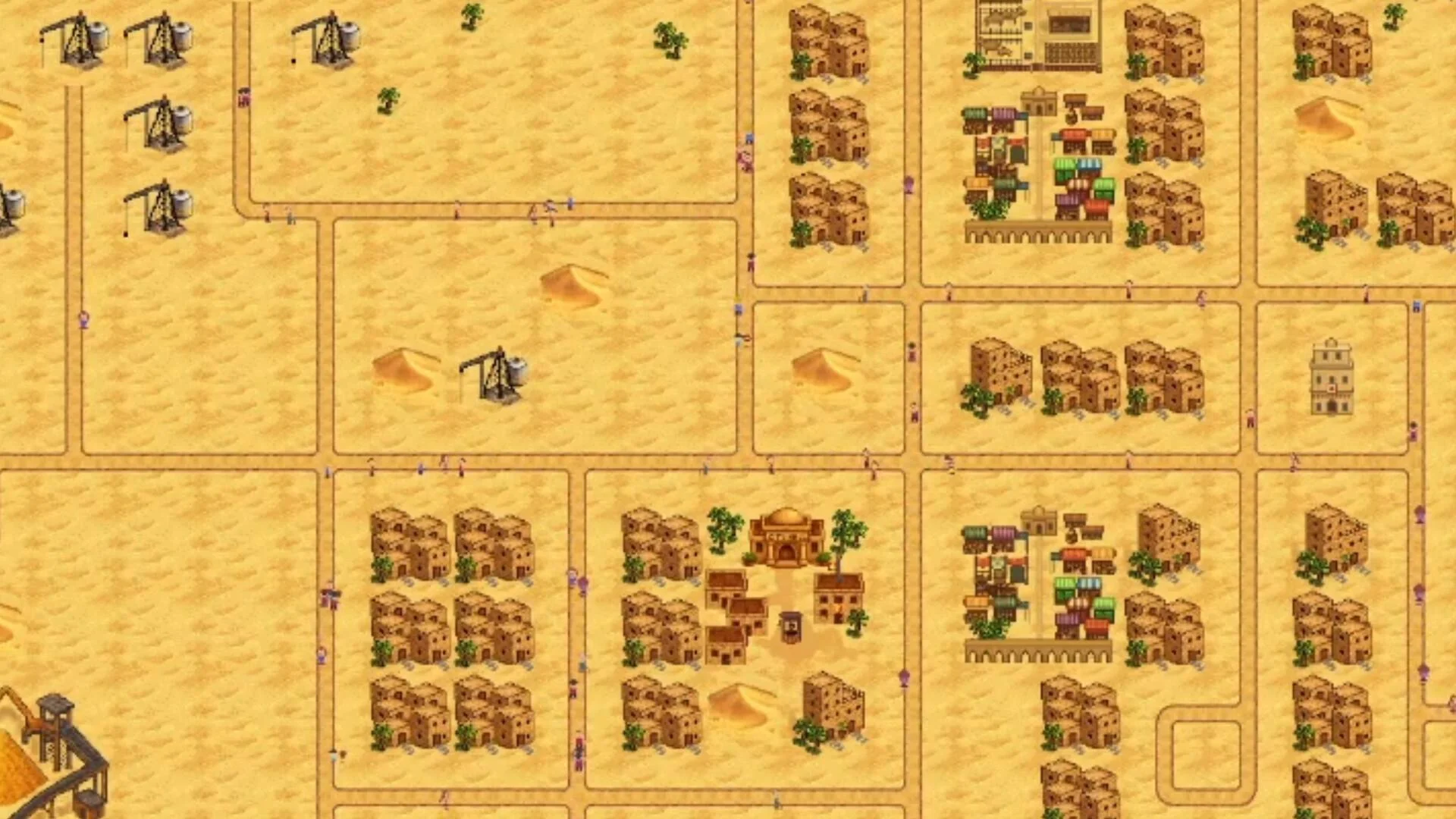 Desert city with oil pumps, dense housing, markets and gridded roads