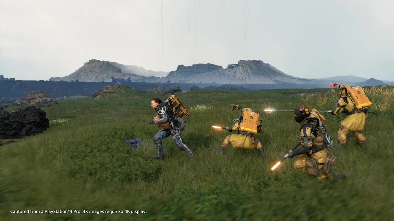 Sam Bridges traversing rugged terrain in Death Stranding Director's Cut