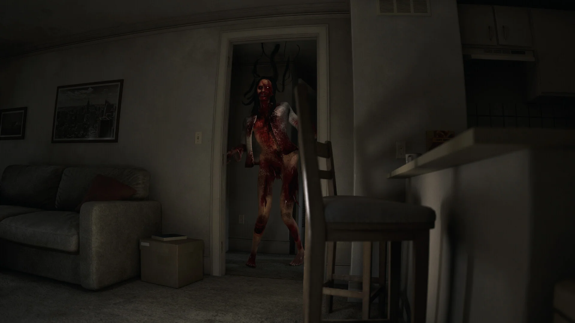 Dim apartment: blood-smeared woman with dark head tendrils standing in a doorway, sofa and chair in the foreground