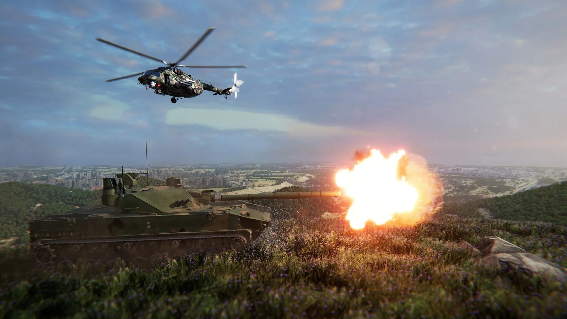A tank fires from a grassy ridge while a helicopter crosses above a distant city