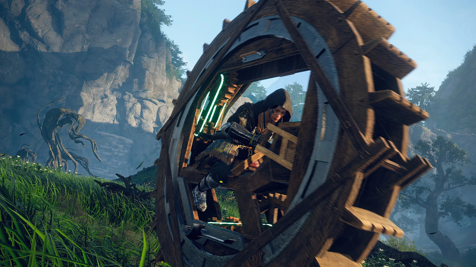 A hunter inside a wooden wheel mechanism against the sky.