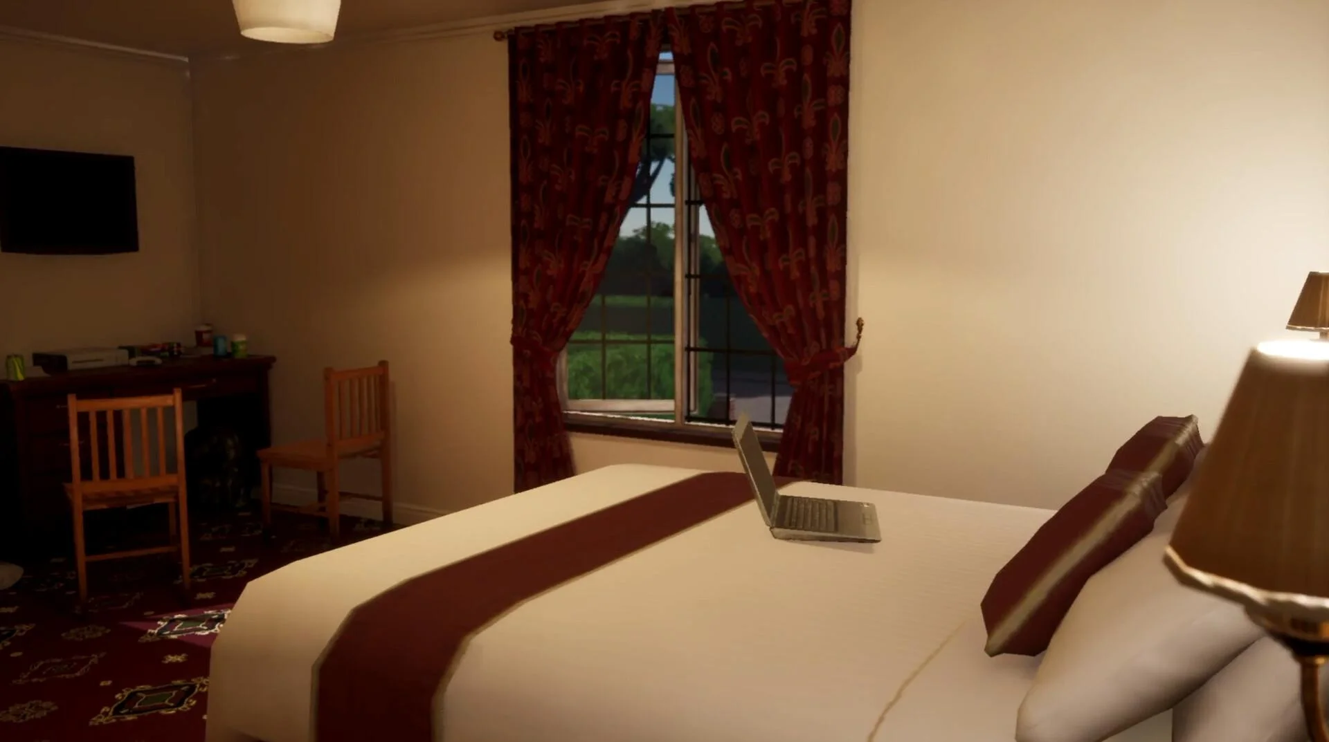 Hotel bedroom with an open laptop resting on the bed