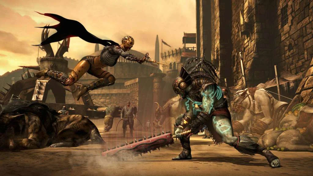 Kitana leaping at Kotal Kahn in a desert arena