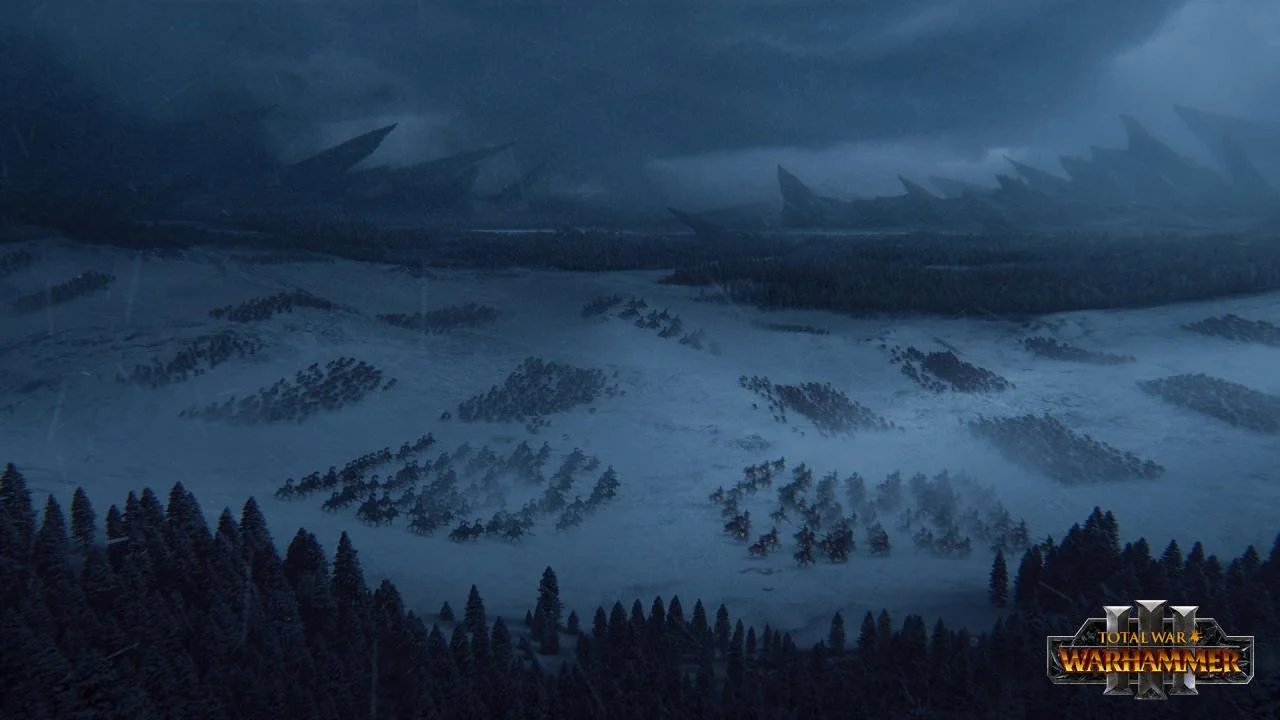 A high view of many army groups crossing a snowfield between pine forests under a dark sky