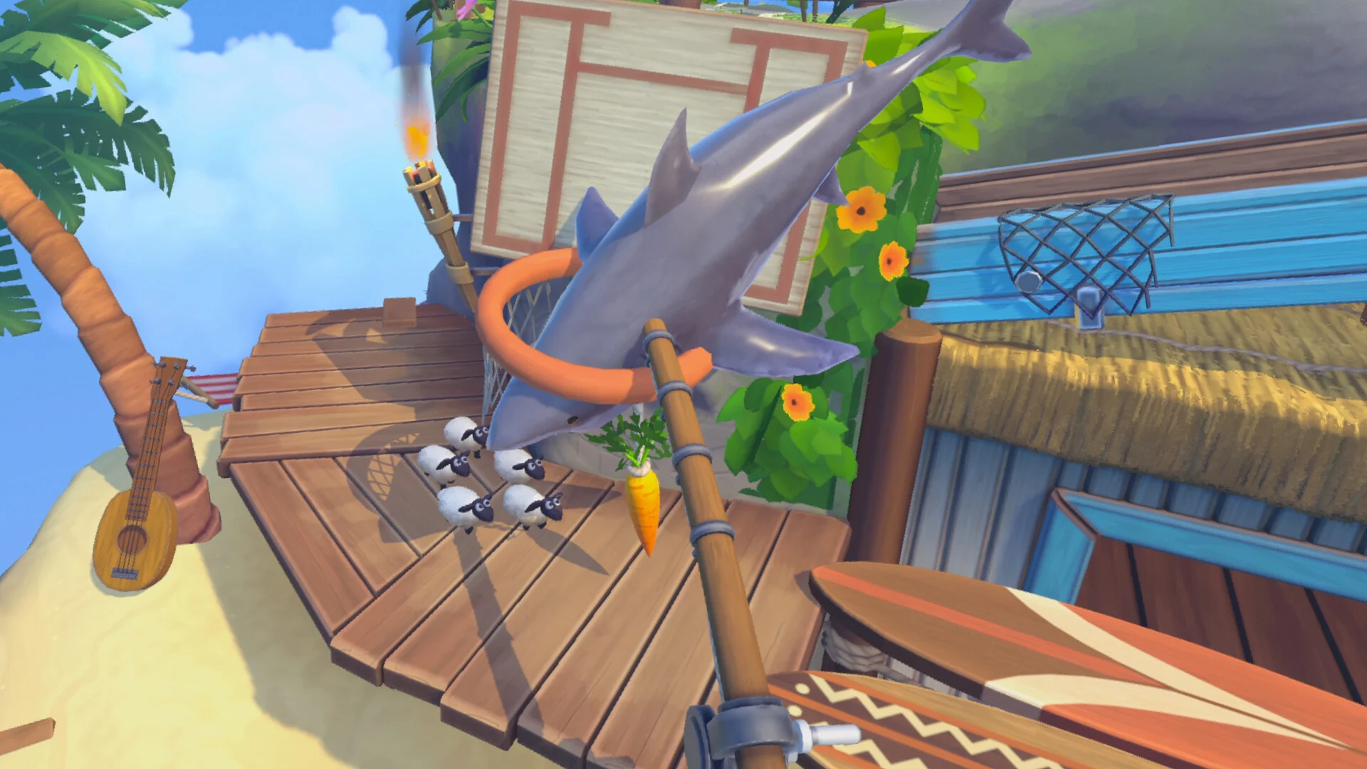 First-person carrot pole holds a grey shark over a wooden beach deck while four tiny sheep stand by a torch, ukulele and surfboard