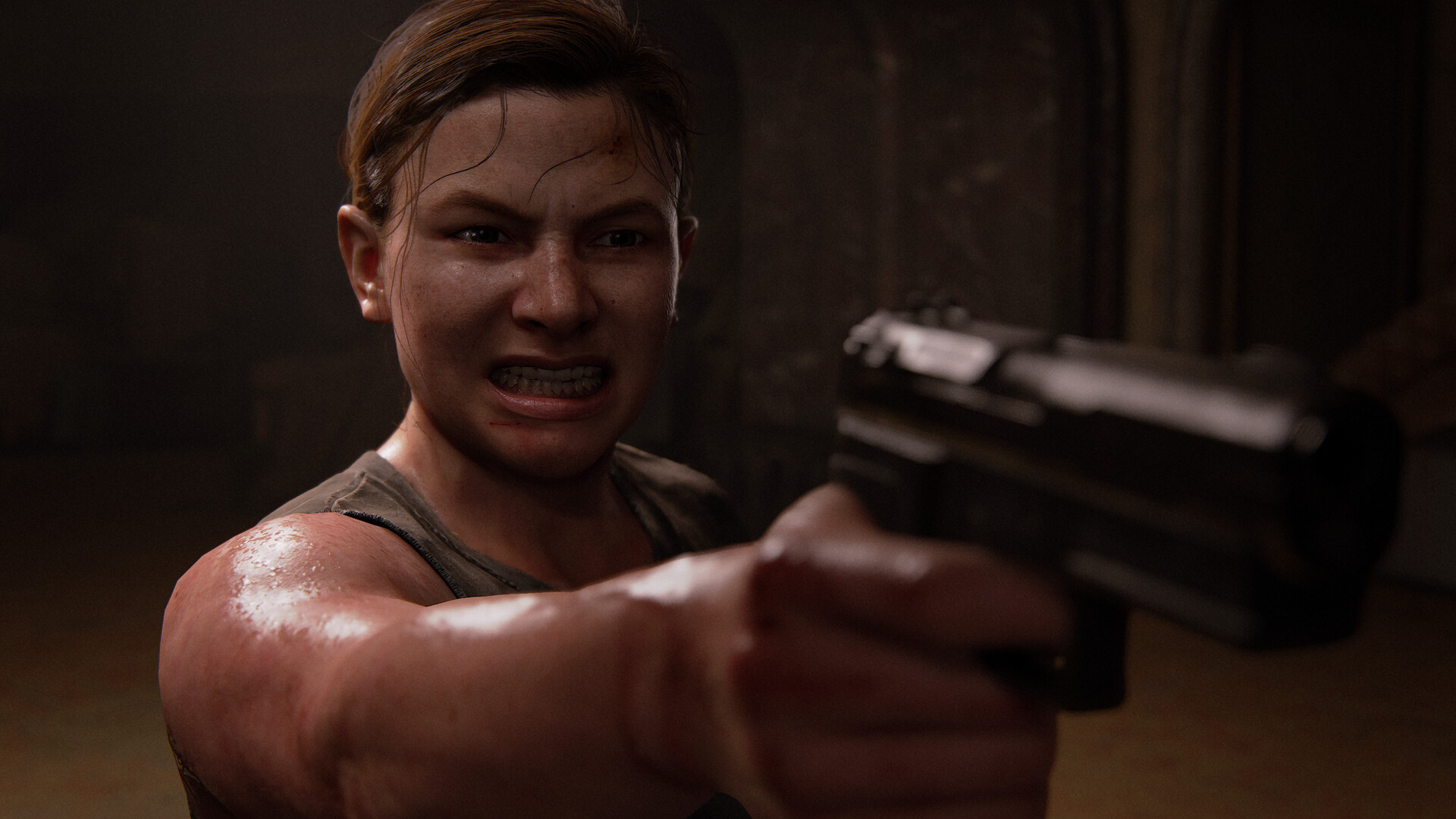 Ellie aims a pistol with a fierce grimace
