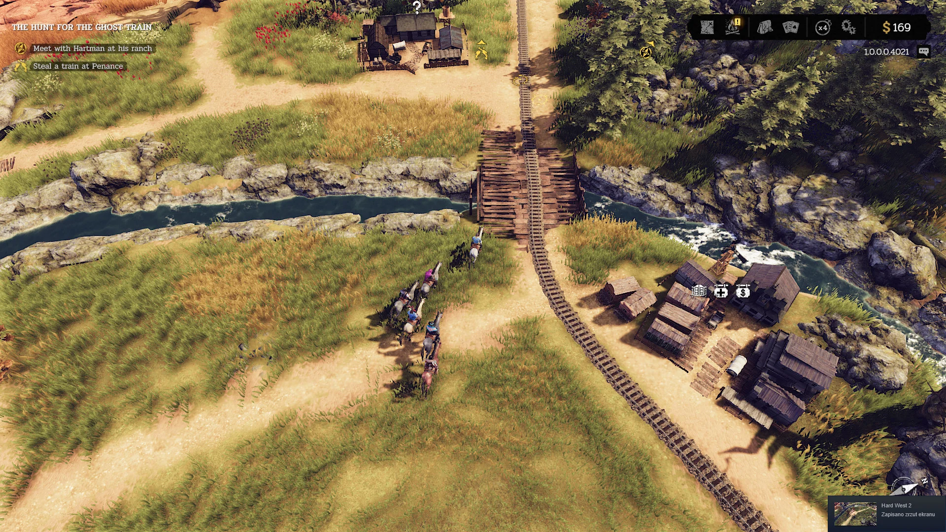 A western town and railway seen from above.