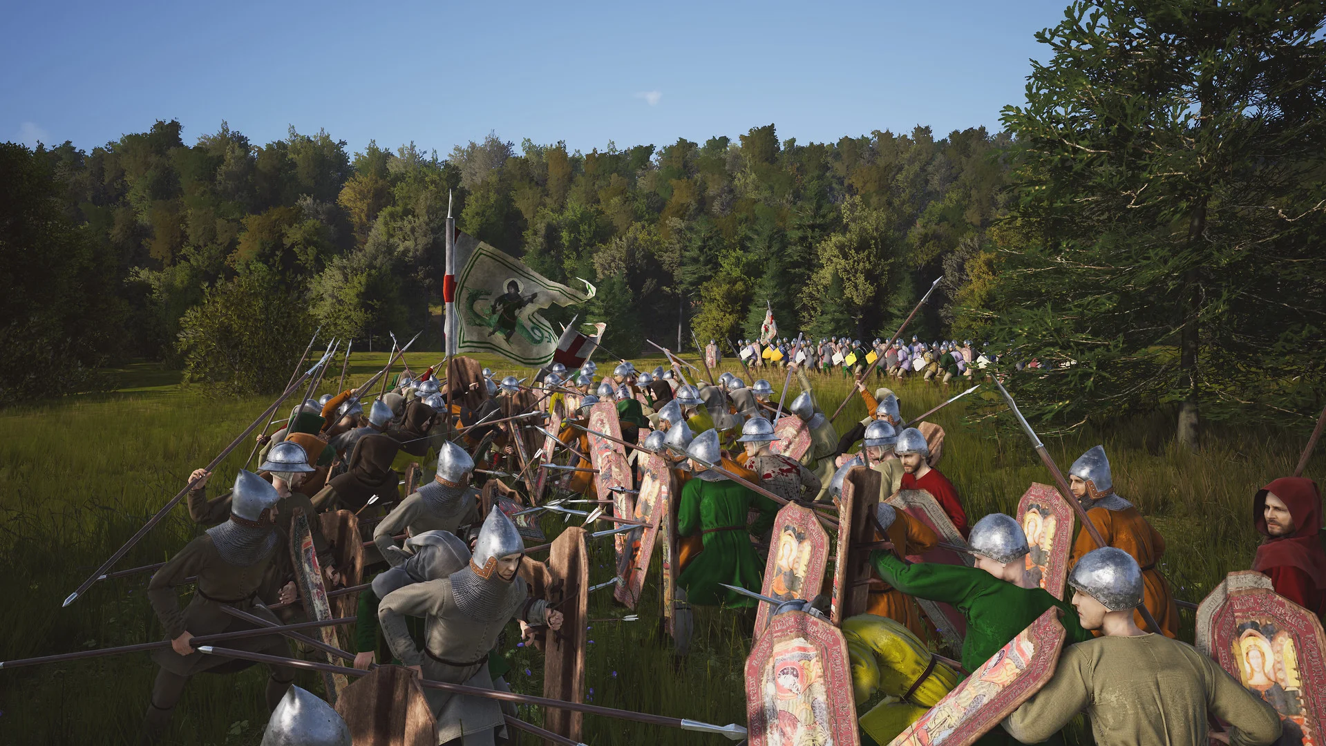 A line of helmeted spearmen with painted shields and a white banner on a grassy field