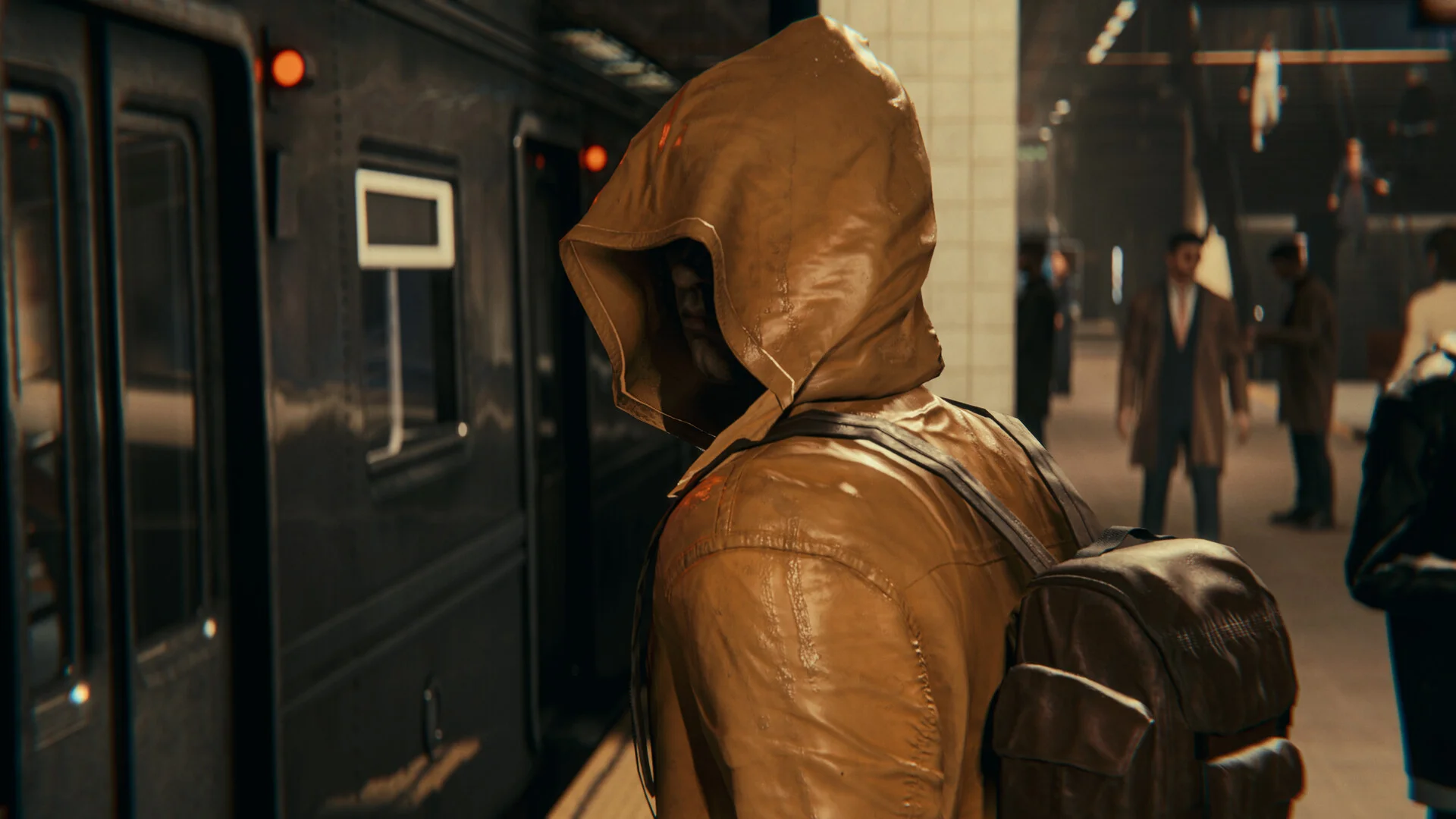 Tan hooded raincoat and backpack on a subway platform, black car and a man in a coat further down
