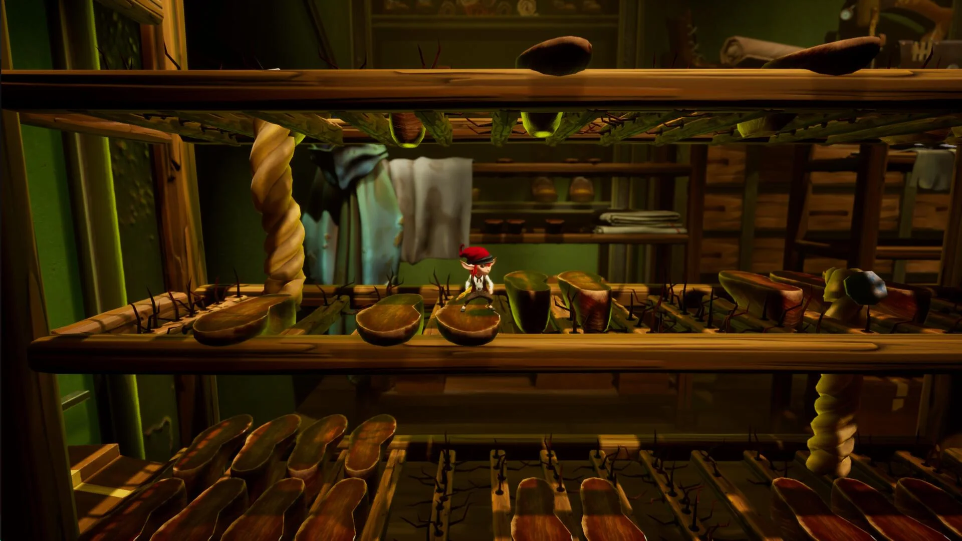 A tiny red-capped figure in a white shirt stands on hanging hams and sausages on wooden drying racks in a green storeroom