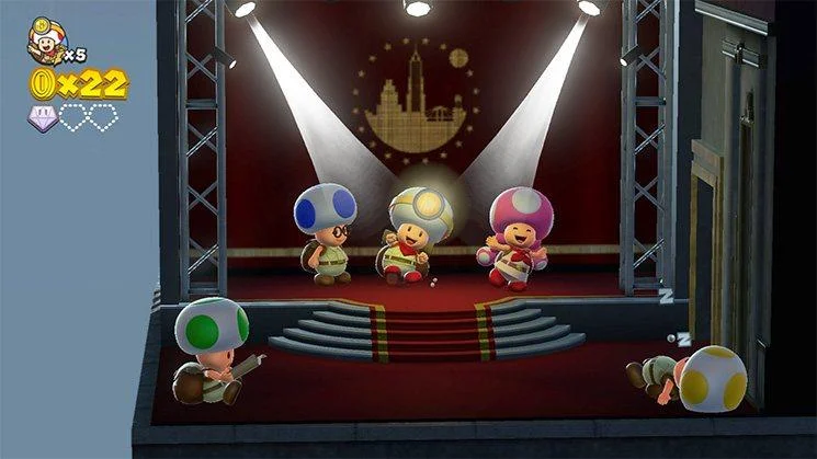 Toad and Toadette on a red stage under spotlights.