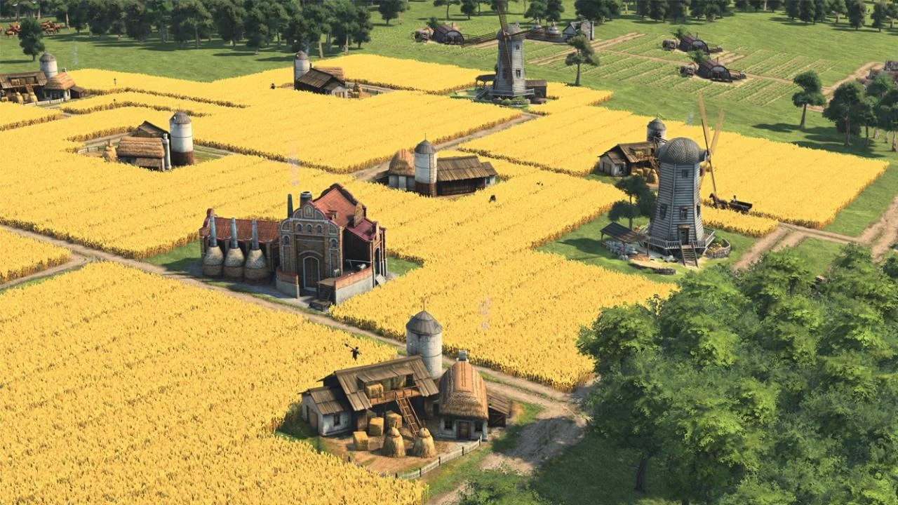 Square golden wheat fields around a red-brick farm, silos and two timber windmills on a sunny plain