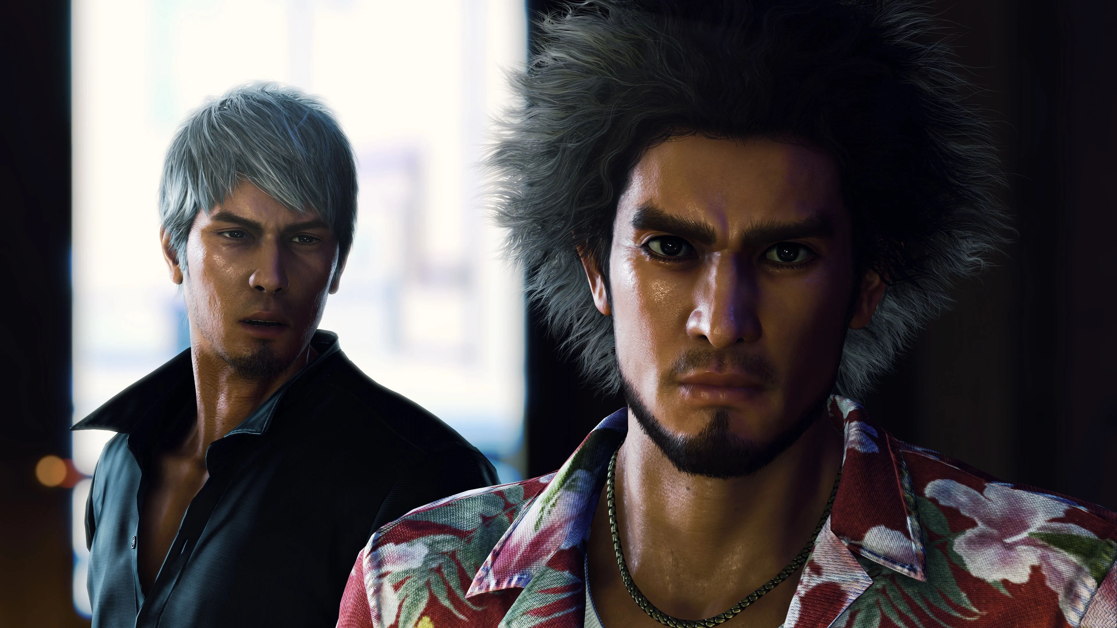 Close-up of Ichiban in a floral shirt with Kiryu in a black shirt behind him
