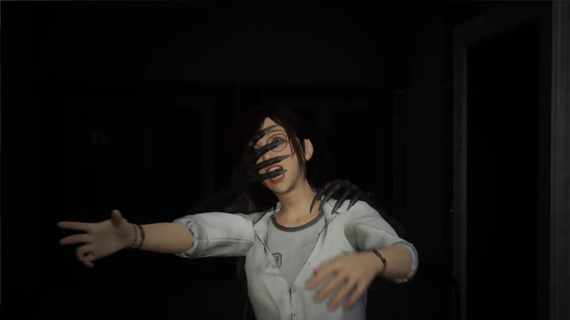 Ghost claw covering a student face in a dark hallway