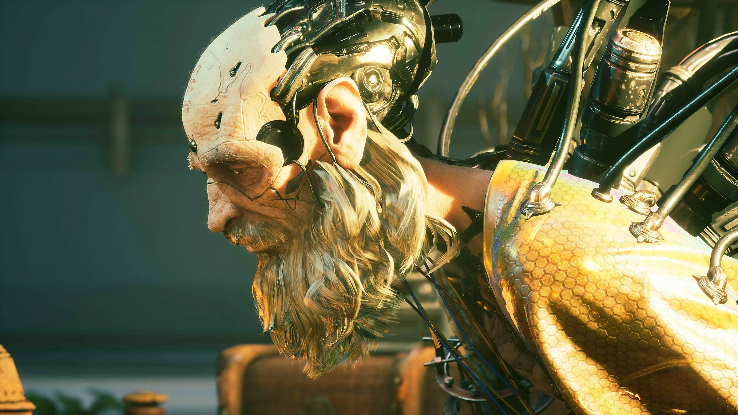 Close-up of a bearded man with a metal skull plate, cables and a gold honeycomb shoulder