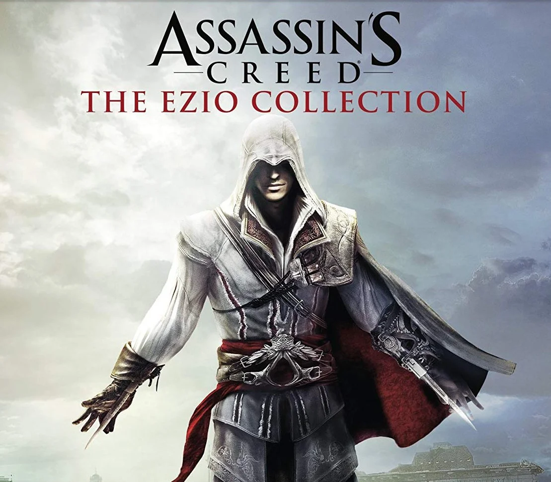 Okładka: Ezio Auditore w białej kapuzyjnej szacie asasyna z czerwoną szarfą i ukrytymi ostrzami, tytuł Assassin's Creed The Ezio Collection nad zachmurzonym niebem