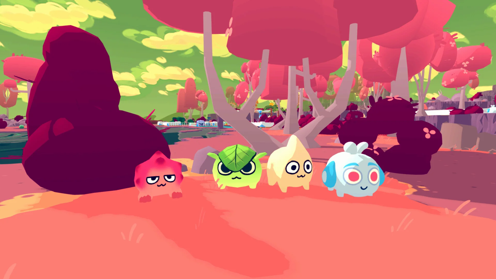 Four round Morps on pink sand: pink, leaf-green, cream and blue headset blobs under red trees