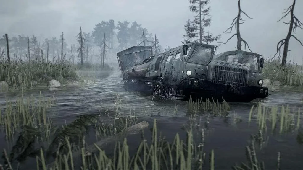 Dark tanker truck fording a misty marsh between dead pines and reeds