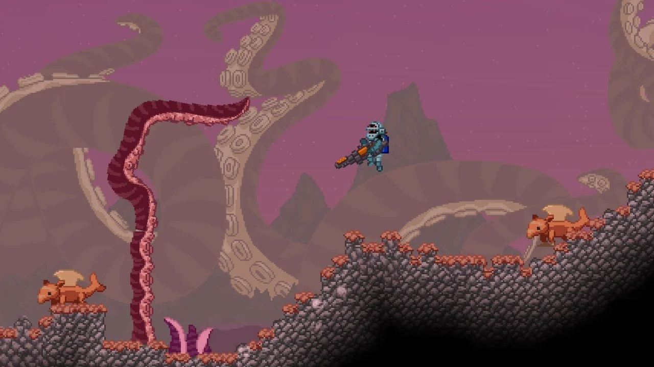 Blue armored hunter with a gun among giant tentacles and brown creatures on a pink world