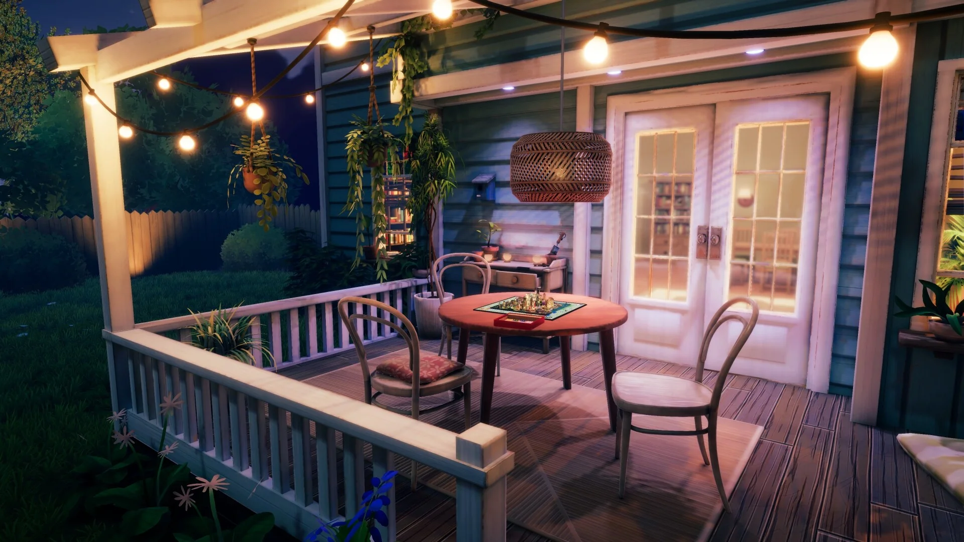 Night porch with string lights, four chairs and a Monopoly board on a round table by white double doors