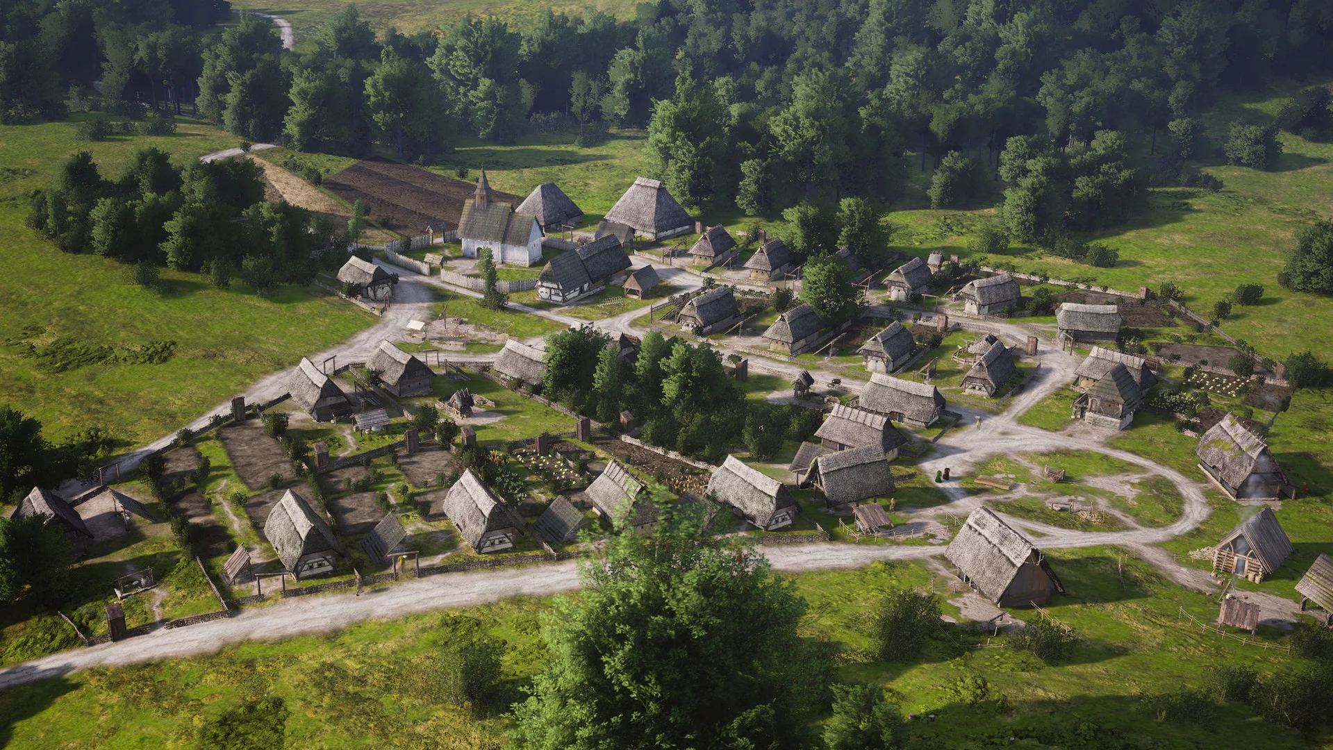 Aerial view of a green thatched village with fenced burgage plots around a small church