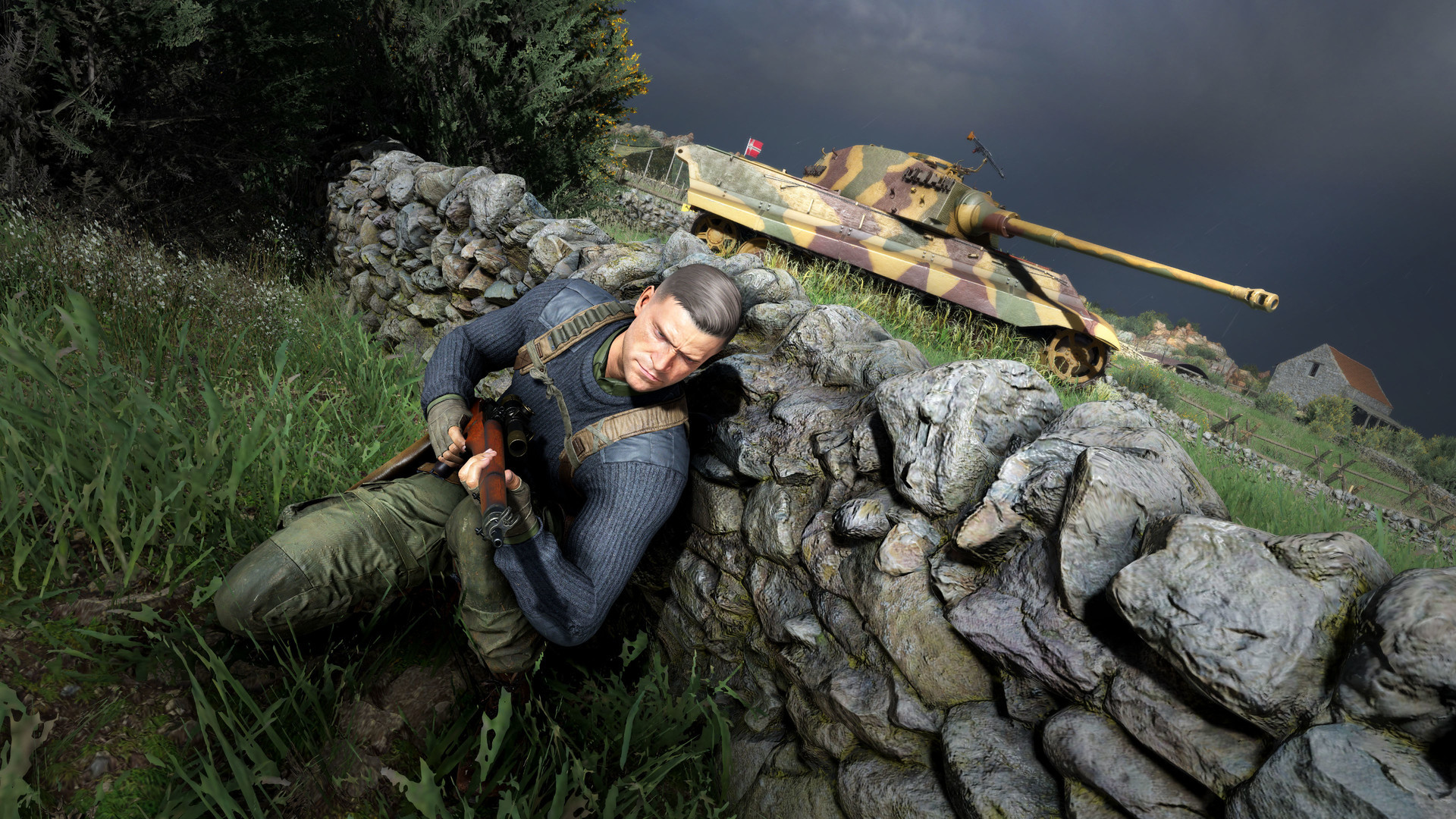 Karl hides behind a stone wall near a camouflaged tank