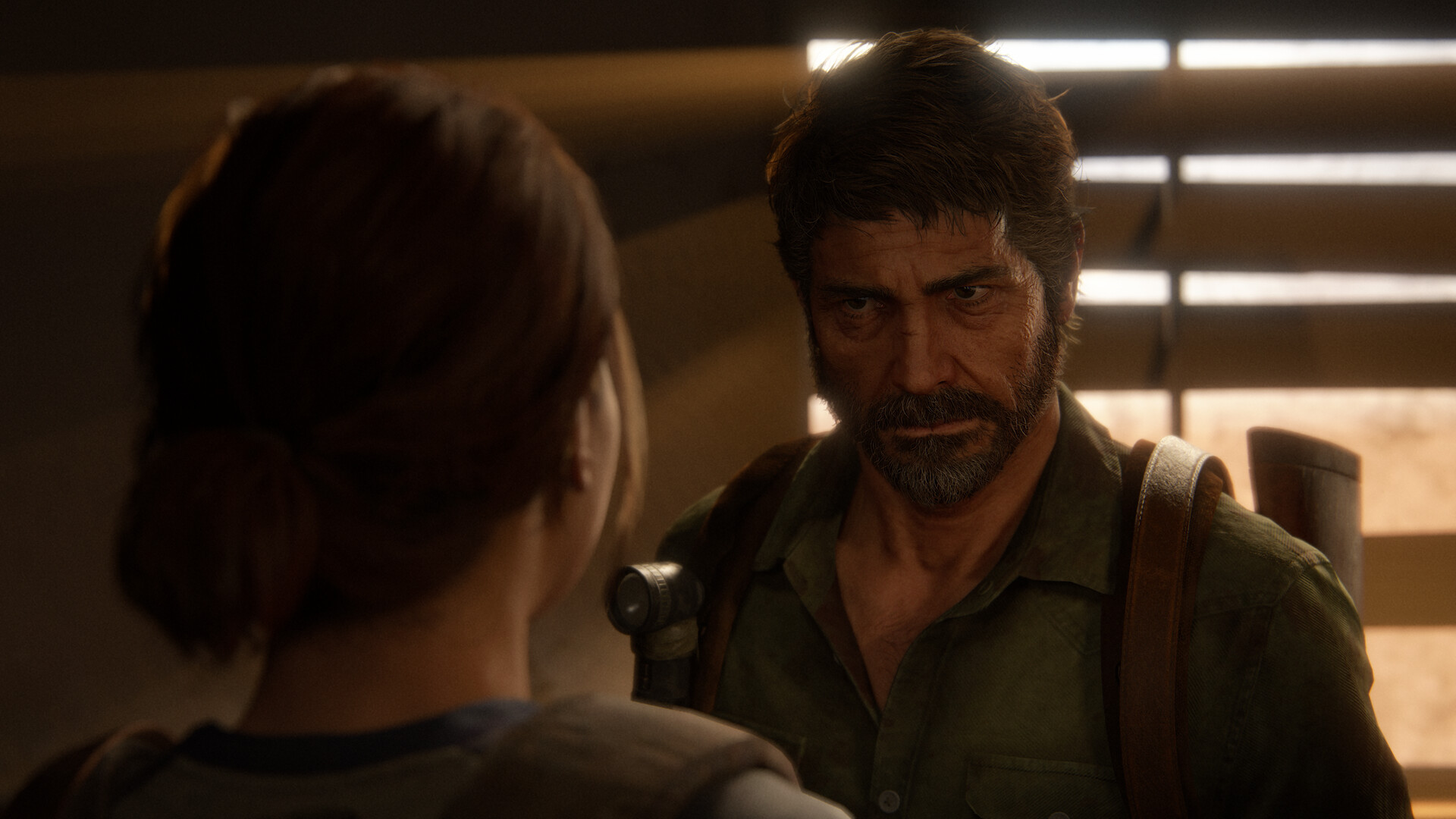 Joel faces Ellie in a sunlit room