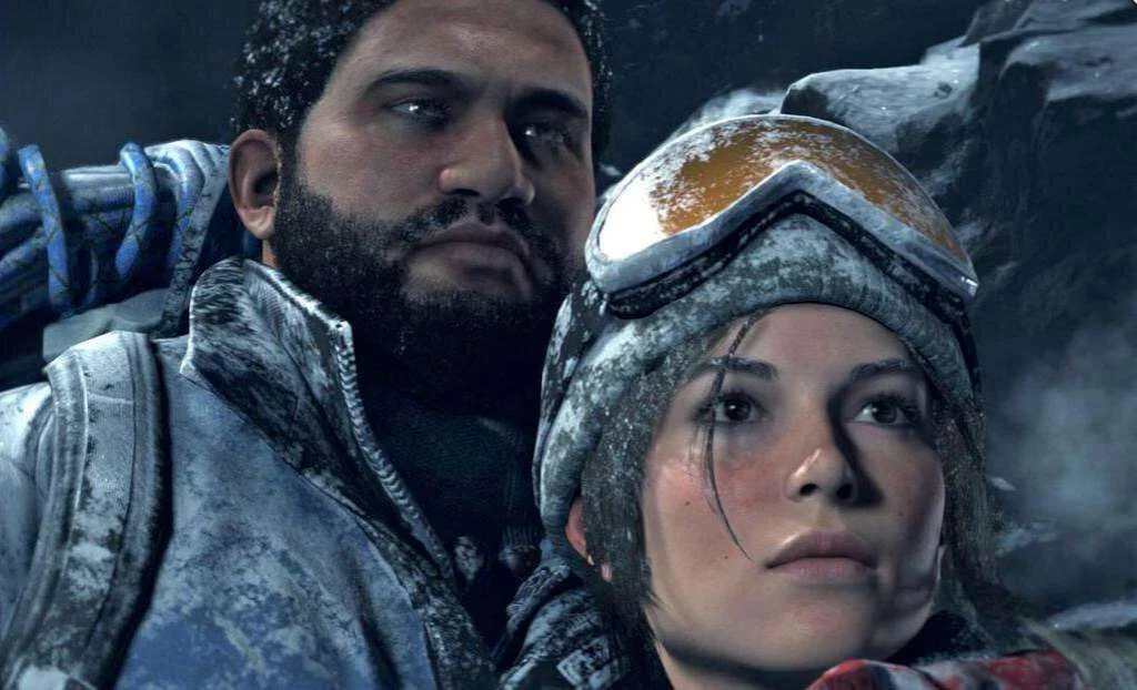 Lara Croft and a bearded companion in winter gear