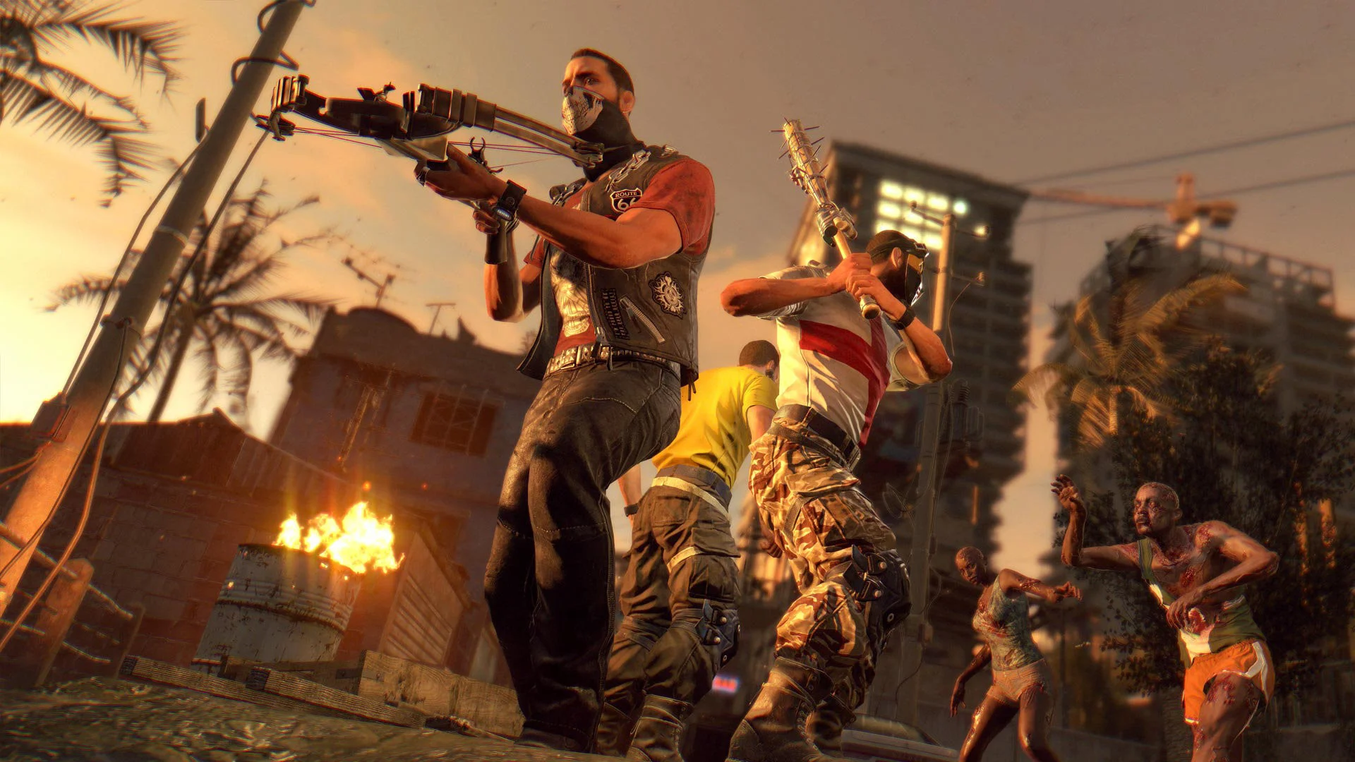 Four survivors on a rooftop at dusk with a crossbow, spiked bat and approaching walkers