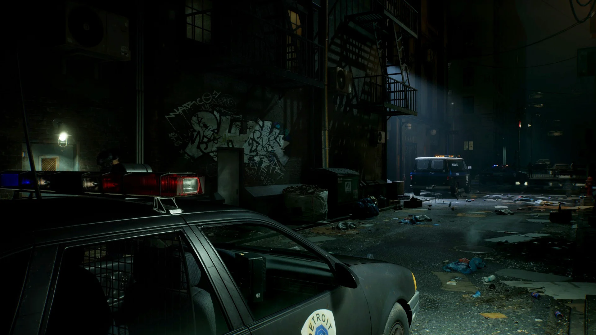 RoboCop standing in a dark rainy street.