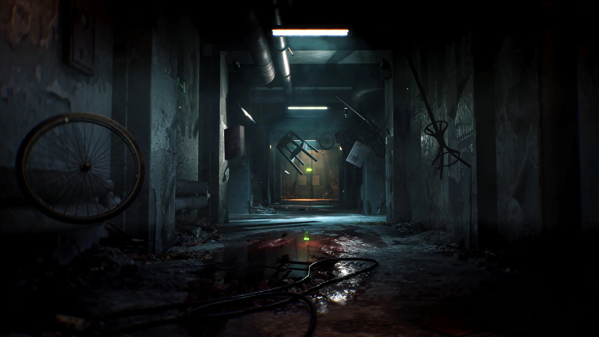 A flooded concrete corridor with a bicycle wheel, hanging furniture, and a pool of blood